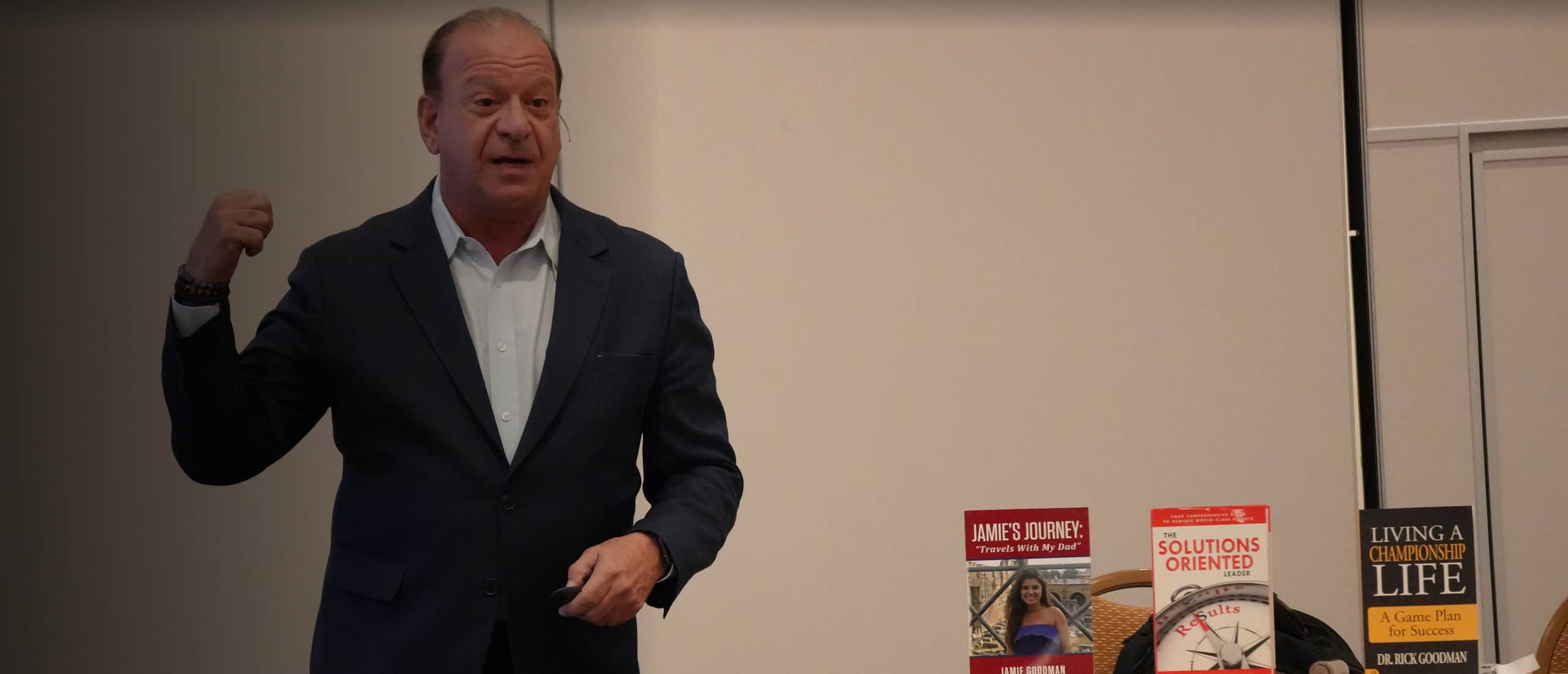 Dr. Rick Goodman solutions oriented leader keynote speaker on stage