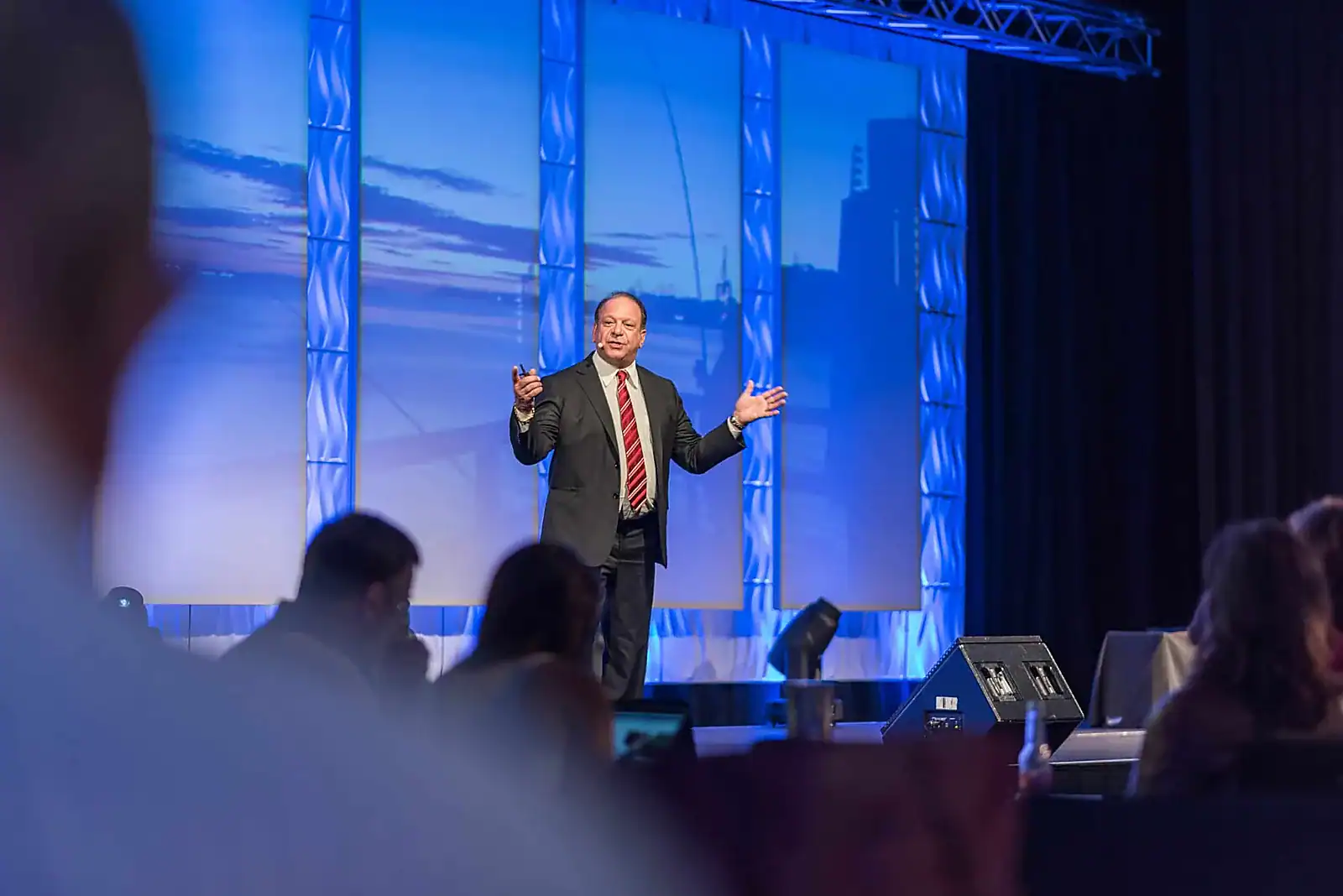 Dr. Rick Goodman leadership keynote speaker on stage at a corporate conference