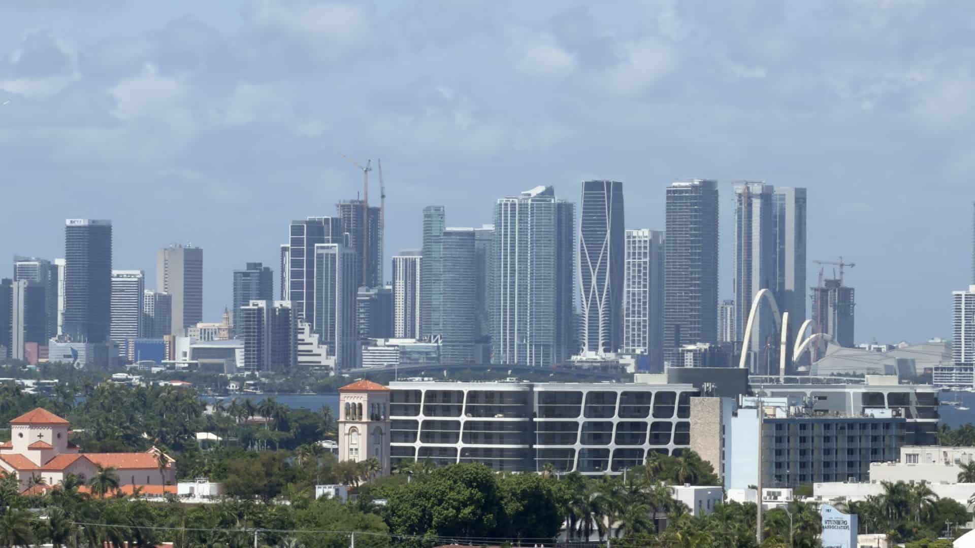 Downtown Miami skyline with skyscrapers under construction and Biscayne Bay, backdrop for Florida motivational speaker Dr. Rick Goodman
